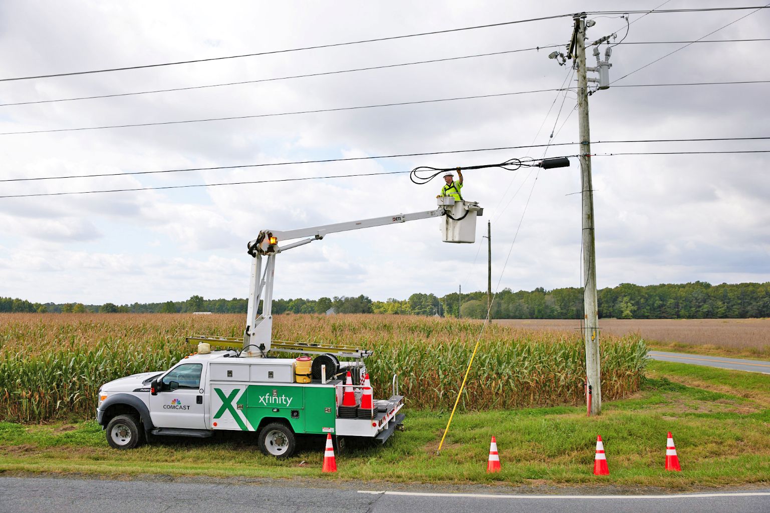 A Comcast technician connects fiber lines in rural Indiana.